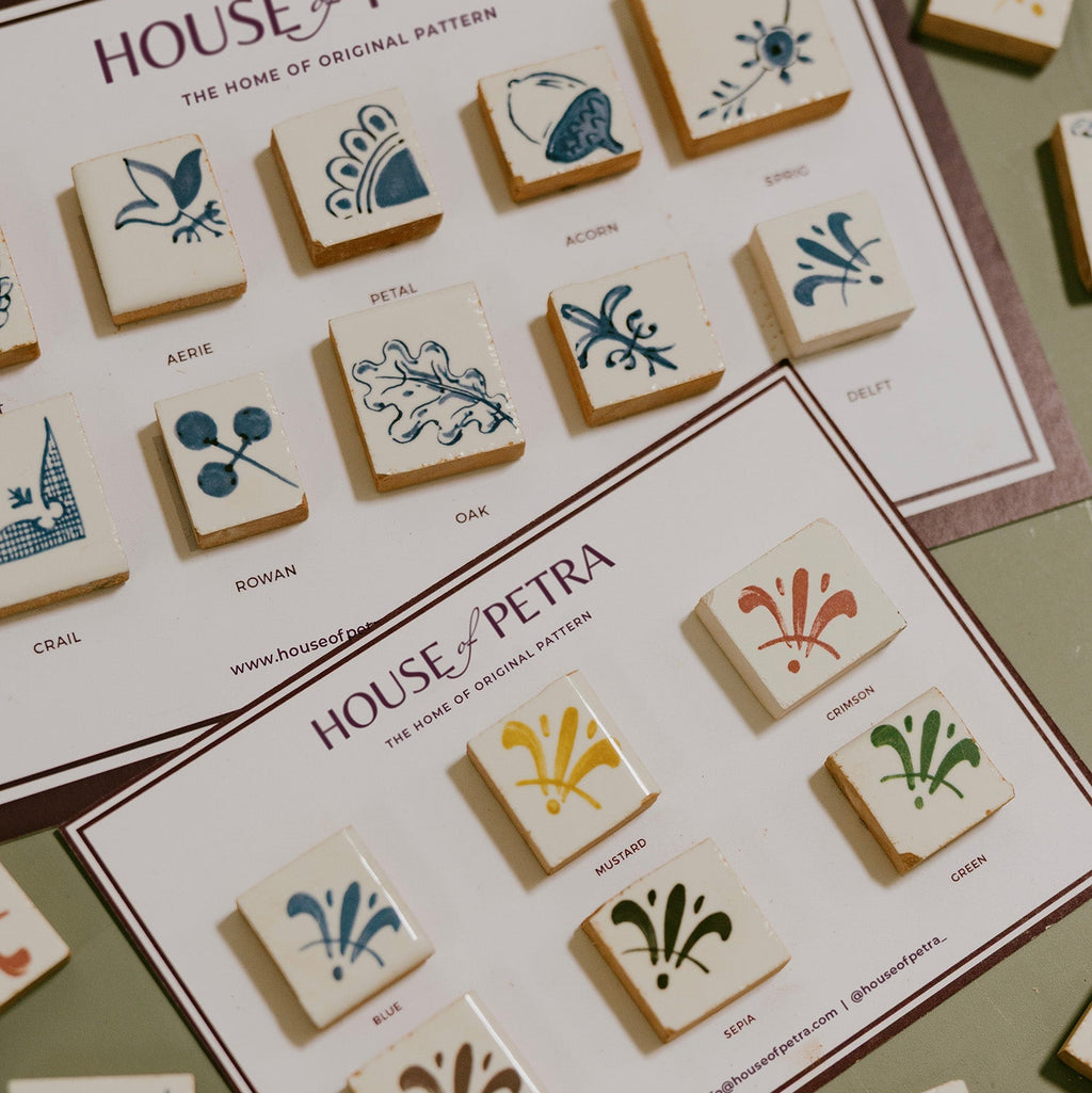Two postcards showing different illustrated tile corners