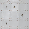 White tiles with small sepia patterns and literature themed illustrations