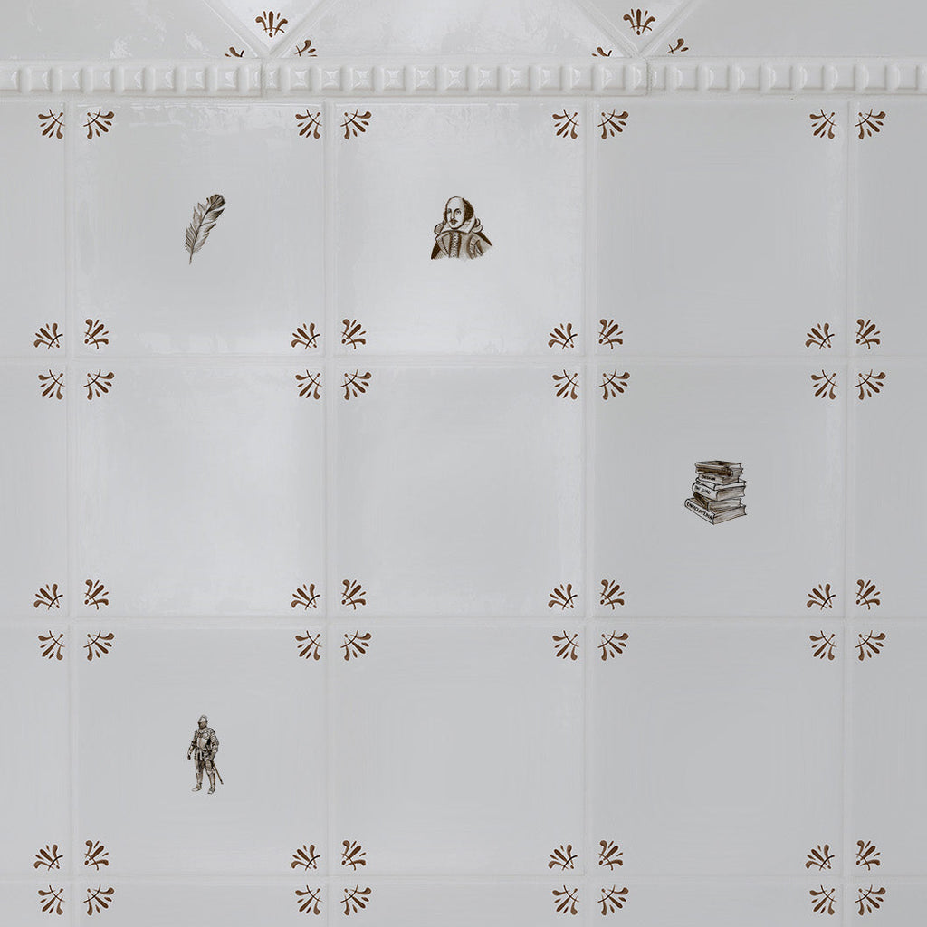 White tiles with small sepia patterns and literature themed illustrations