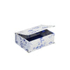 A rectangular storage box with a hinged lid, featuring a blue floral toile de Jouy pattern on a white background, shown open against a plain white background.
