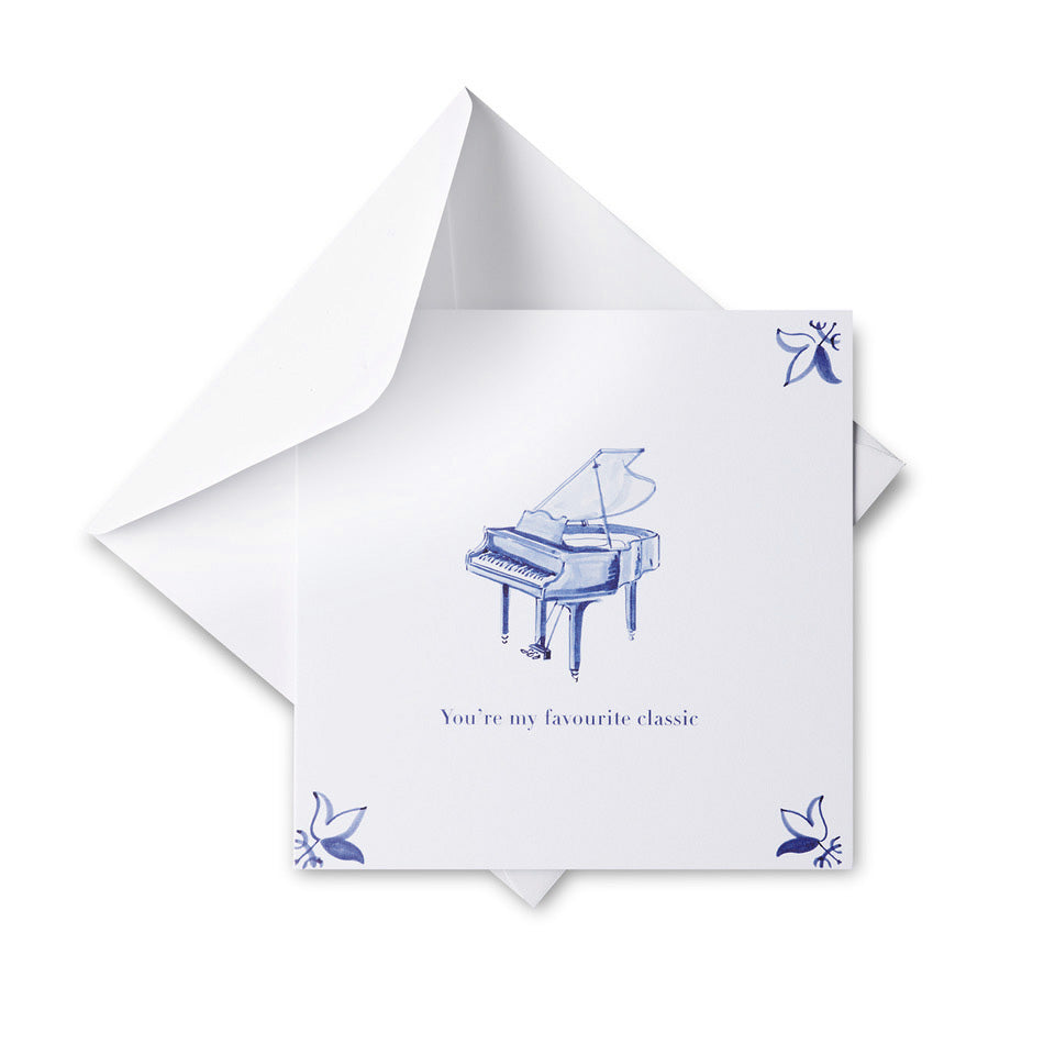 White card with blue piano illustration and text on a white background