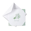 White card with green floral design and text 'Here's to you' on a white background