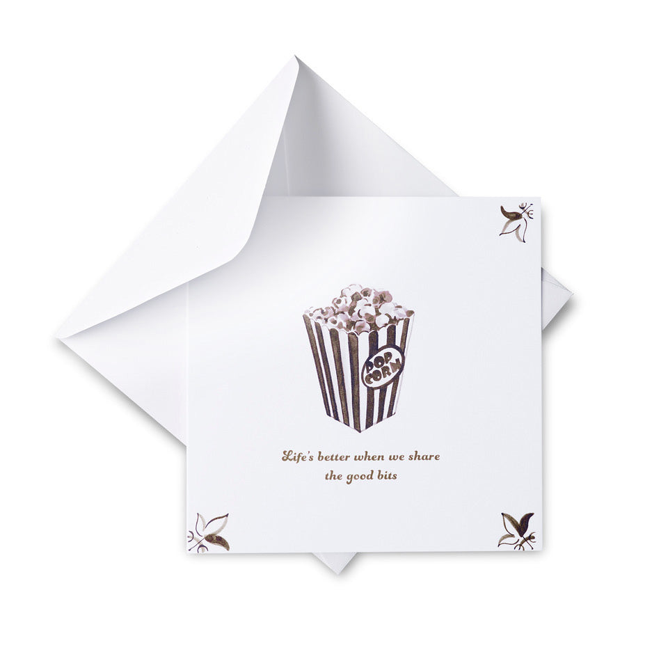 White card with a popcorn illustration and text on a white background